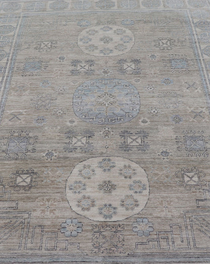 Measures: 6'0 x 9'1 Khotan Design Rug with Circular Medallion in Light Green, Light Blue, and Cream. Keivan Woven Arts , rug/AWR - 12172 country of origin / type: Afghanistan / Khotan. This Khotan features a geometric all - over design flanked b... - Keivan Woven ArtsAWR - 12172 - 23217