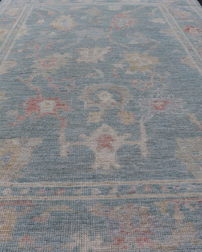 Measures: 3'11 x 5'11 Modern Oushak Rug with a Light Blue - Gray Field With All - Over Floral Motifs. Keivan Woven Arts; rug AWR - 12302 Country of Origin: Afghanistan Type: Oushak Design: All - Over, Floral. Hand - Knotted in wool, this rustic piece hold... - Keivan Woven ArtsAWR - 12302 - 23241Rug
