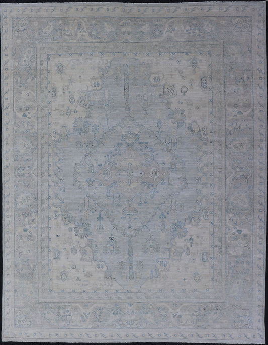 Measures: 8'10 x 11'8 Modern Designed Rug With A Light Blue Background and Tribal Medallion Motifs. Keivan Woven Arts; rug AWR - 12323 Country of Origin: Afghanistan Type: Oushak Design: Floral, Medallion Abstract - Tribal This Oushak presents ... - Keivan Woven ArtsAWR - 12323 - 23396Rug
