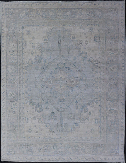 Measures: 8'10 x 11'8 Modern Designed Rug With A Light Blue Background and Tribal Medallion Motifs. Keivan Woven Arts; rug AWR - 12323 Country of Origin: Afghanistan Type: Oushak Design: Floral, Medallion Abstract - Tribal This Oushak presents ... - Keivan Woven ArtsAWR - 12323 - 23396