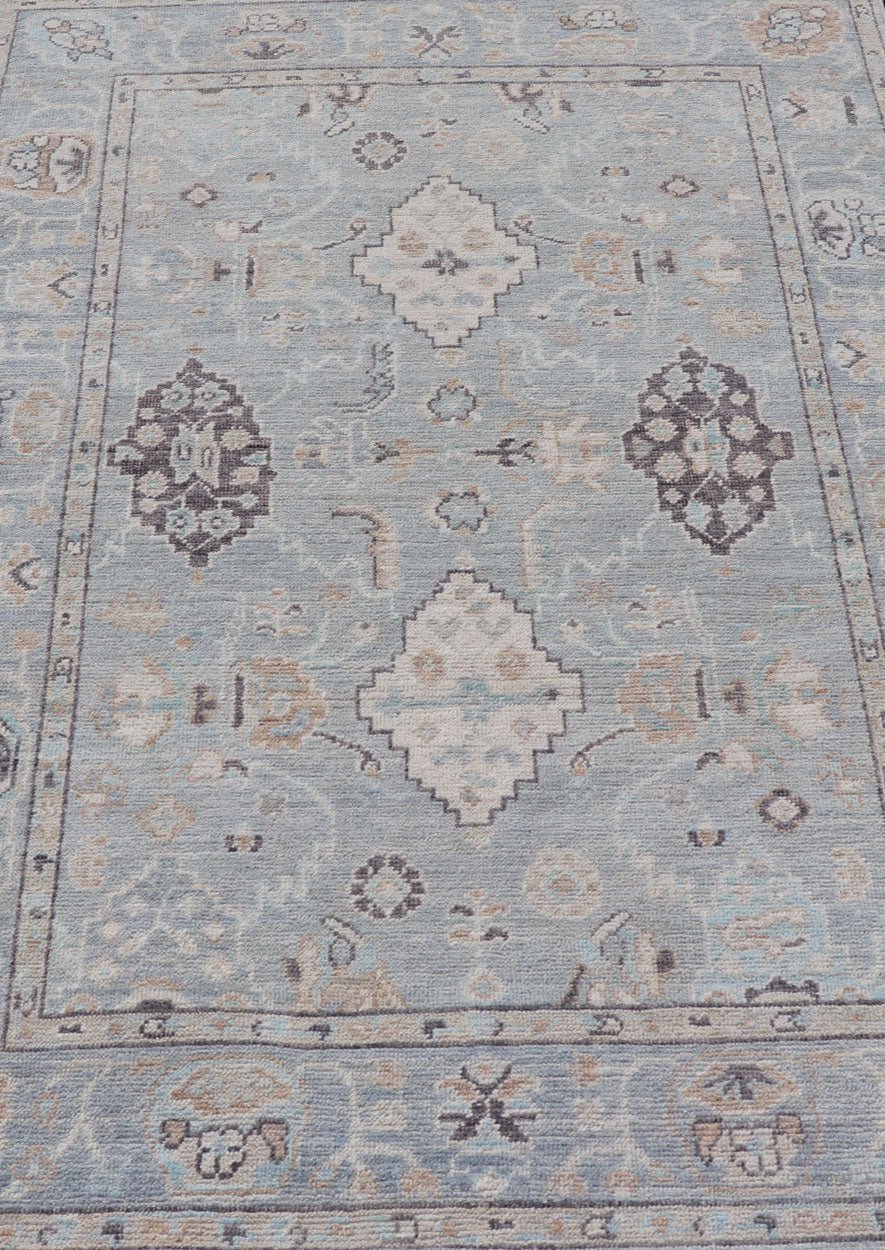 Measures: 4'1 x 6'1 Light Blue - Gray Background Modern Oushak with All - Over Tribal Motifs With Gray. Country of Origin: Afghanistan; Type: Oushak; Design: Medallion, Tribal Medallion, All - Over; Keivan Woven Arts: rug AWR - 12335 21st Century. This... - Keivan Woven ArtsAWR - 12335 - 23246