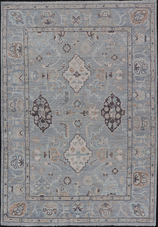 Measures: 4'1 x 6'1 Light Blue - Gray Background Modern Oushak with All - Over Tribal Motifs With Gray. Country of Origin: Afghanistan; Type: Oushak; Design: Medallion, Tribal Medallion, All - Over; Keivan Woven Arts: rug AWR - 12335 21st Century. This... - Keivan Woven ArtsAWR - 12335 - 23246Rug