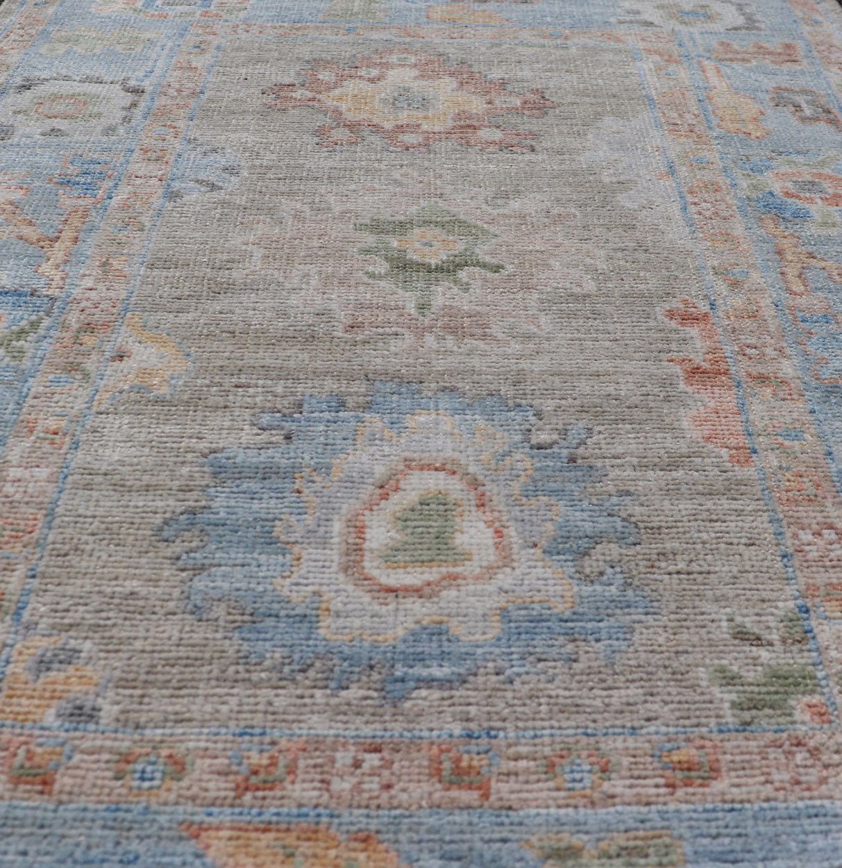 Measures: 2'7 x 4'0 Modern Floral Oushak With Sandy - Brown Background and A Sky Blue Border. Keivan Woven Arts; rug AWR - 12378 Country of Origin: Afghanistan Type: Oushak Design: Floral, Arabesque, All - Over. This piece gives a modern vibrancy... - Keivan Woven ArtsAWR - 12378 - 23258Rug