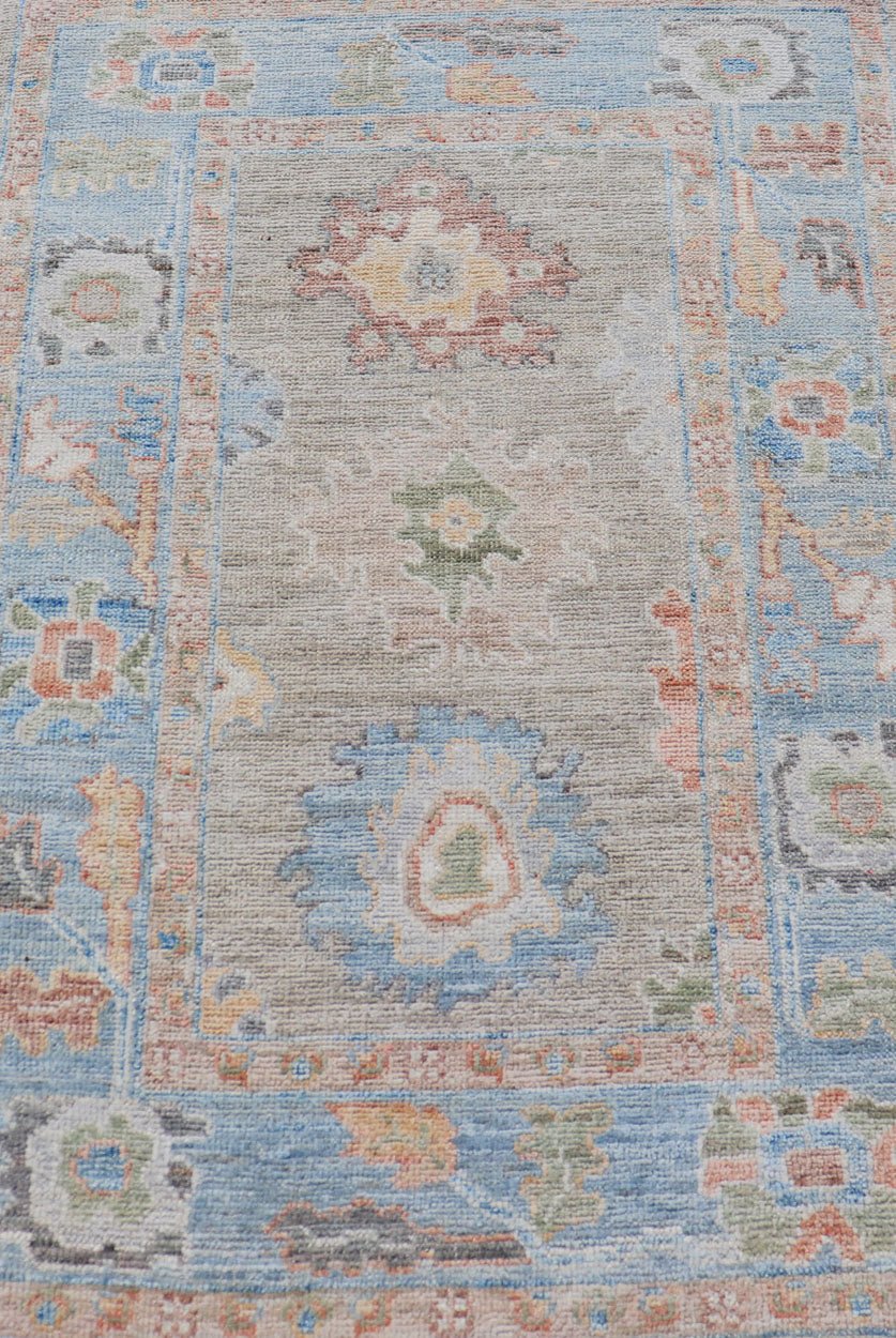 Measures: 2'7 x 4'0 Modern Floral Oushak With Sandy - Brown Background and A Sky Blue Border. Keivan Woven Arts; rug AWR - 12378 Country of Origin: Afghanistan Type: Oushak Design: Floral, Arabesque, All - Over. This piece gives a modern vibrancy... - Keivan Woven ArtsAWR - 12378 - 23258Rug