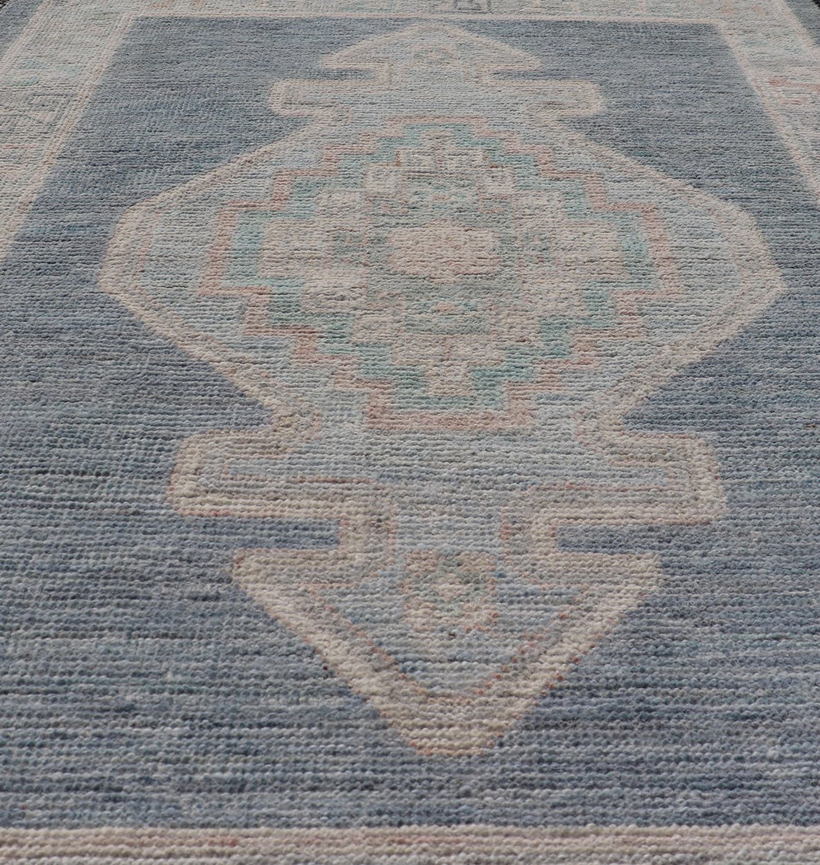 Measures: 2'7 x 3'11 Medallion Designed Modern Oushak with Blue Background and Cream Border. Keivan Woven Arts; rug AWR - 12400, Early 21st Century. This modern Oushak features large medallions in the center of a blue background, centering aro... - Keivan Woven ArtsAWR - 12400 - 23276Rug