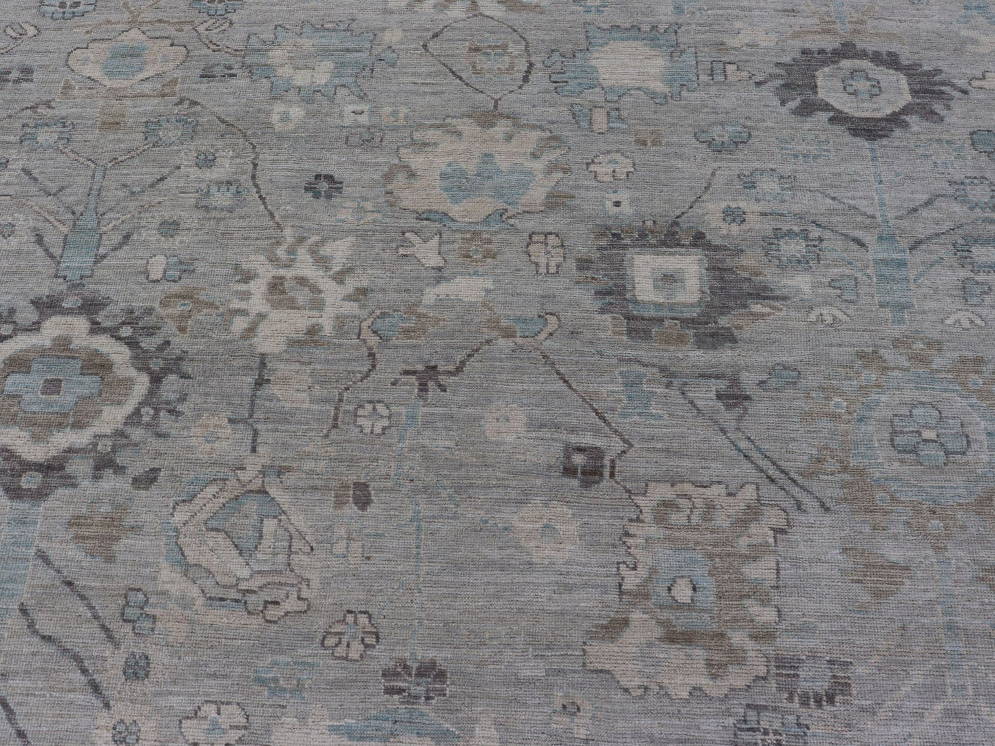 Measures: 13'4 x 19'3 Large Modern Oushak Design in Light Blue, Grey, with Light Cream Background. Keivan Woven Arts; rug AWR - 12521 Country of Origin: Afghanistan Type: Oushak Design: All - Over, Floral. This rustic piece holds charm within a powd... - Keivan Woven ArtsAWR - 12521 - 23402Rug