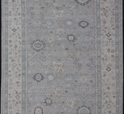 Measures: 13'4 x 19'3 Large Modern Oushak Design in Light Blue, Grey, with Light Cream Background. Keivan Woven Arts; rug AWR - 12521 Country of Origin: Afghanistan Type: Oushak Design: All - Over, Floral. This rustic piece holds charm within a powd... - Keivan Woven ArtsAWR - 12521 - 23402