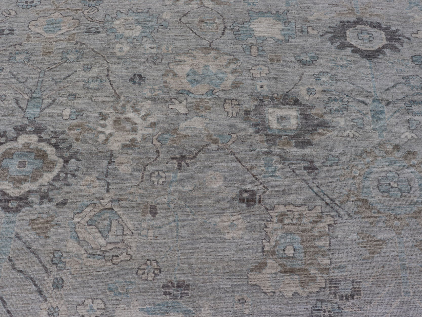 Measures: 13'4 x 19'3 Large Modern Oushak Design in Light Blue, Grey, with Light Cream Background. Keivan Woven Arts; rug AWR - 12521 Country of Origin: Afghanistan Type: Oushak Design: All - Over, Floral. This rustic piece holds charm within a powd... - Keivan Woven ArtsAWR - 12521 - 23402