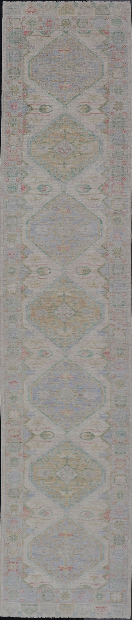 Measures: 3'2 x 16'6 Modern Oushak Runner Design In Cream Background and All - Over Design. Keivan Woven Arts; rug AWR - 12595 Country of Origin: Afghanistan Type: Oushak Design: Floral, All - Over This Oushak designed runner features a classic O... - Keivan Woven ArtsAWR - 12595 - 23312