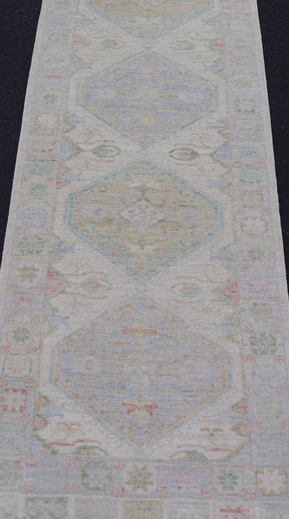Measures: 3'2 x 16'6 Modern Oushak Runner Design In Cream Background and All - Over Design. Keivan Woven Arts; rug AWR - 12595 Country of Origin: Afghanistan Type: Oushak Design: Floral, All - Over This Oushak designed runner features a classic O... - Keivan Woven ArtsAWR - 12595 - 23312