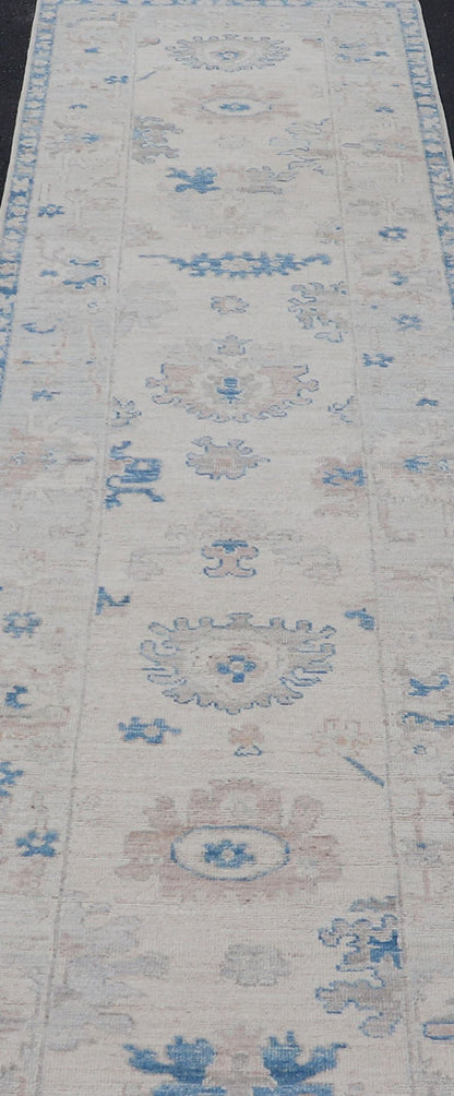 Measures: 2'11 x 12'11 Modern Oushak All - Over Floral Design Runner In Cream, Tan, and Blue. Keivan Woven Arts; rug AWR - 12597 Country of Origin: Afghanistan Type: Oushak Circa 2020 Key Words: Medallion Oushak Runner. This runner starts in th... - Keivan Woven ArtsAWR - 12597 - 23318Rug