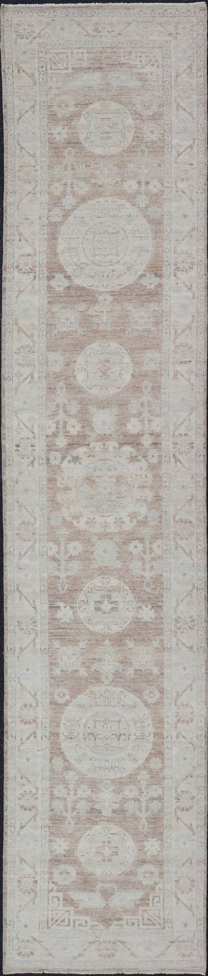 Measures: 2'9 x 14'4 Khotan Design Runner with All - Over Geometric - Circle Medallion Pattern. AWR - 12602 / rug/AWR - 12602 country of origin / type: Afghanistan / Khotan This Khotan features a geometric all - over circle design flanked by a repeati... - Keivan Woven ArtsAWR - 12602 - 23324