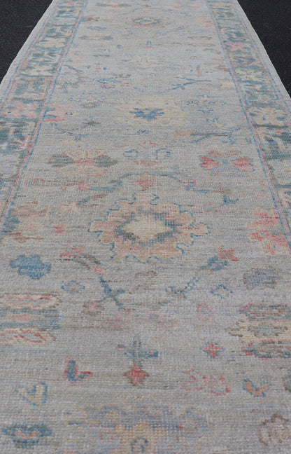 Measures: 2'5 x 9'10 Hand - Knotted Modern Oushak Runner on Light Gray Field and Colorful Motifs. Keivan Woven Arts; rug AWR - 12648 Country of Origin: Afghanistan Type: Oushak Design: Floral, All - Over, Arabesque 21st Century This Oushak runner... - Keivan Woven ArtsAWR - 12648 - 23348Rug