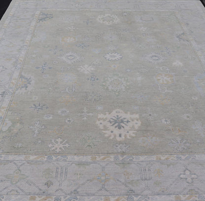 Hand - Knotted Modern Neutral Oushak Rug in Light Gray, Light Blue, Green. Keivan Woven Arts; rug AWR - 16020Country of Origin: Afghanistan Type: Oushak Design: All - Over, Floral Measures: 10.3 x 14.3 This rustic piece holds charm within a powder blu... - Keivan Woven ArtsAWR - 16020 - 24247Rug