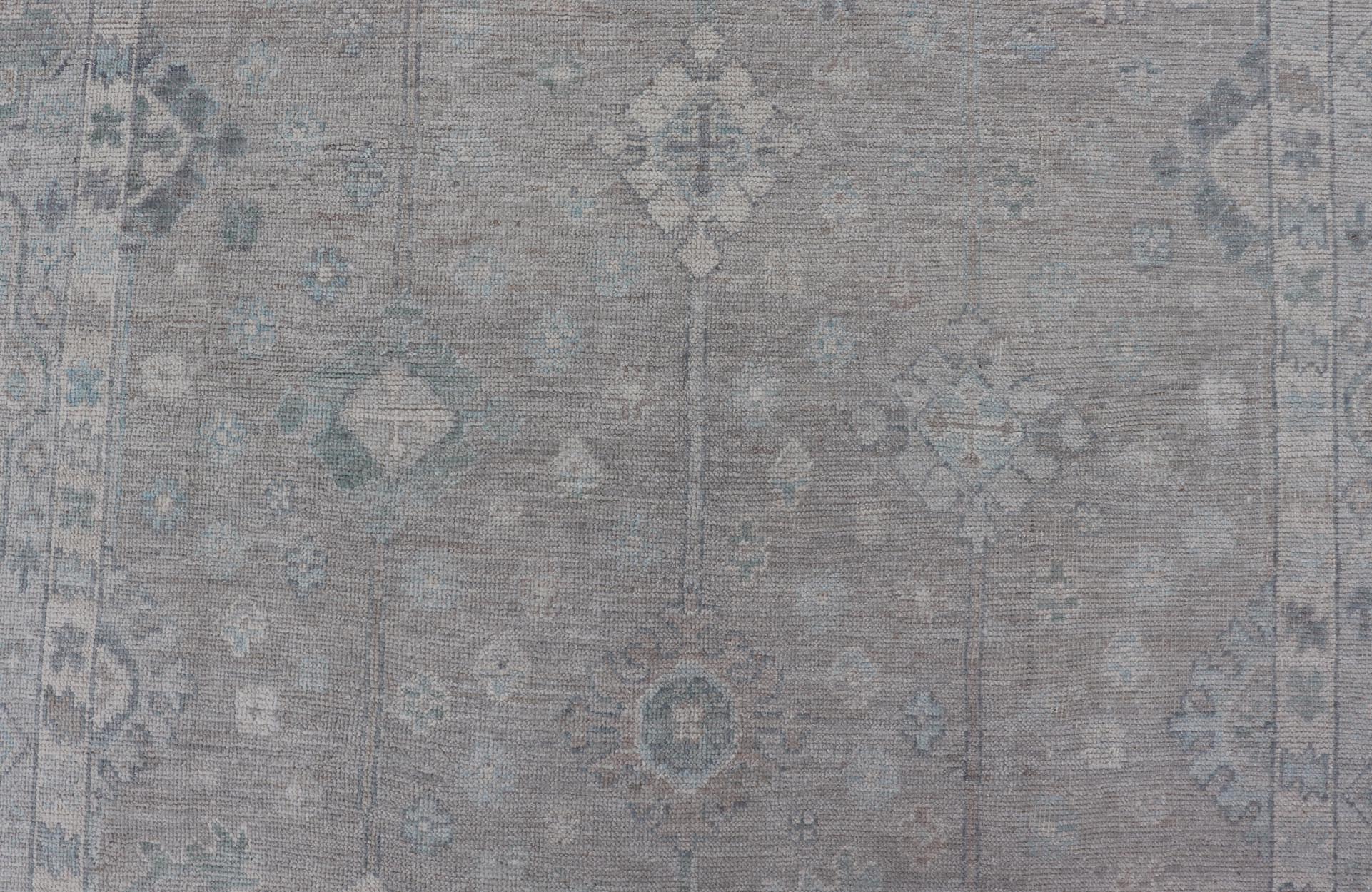 Modern Oushak with Floral Motifs with Cream, Grey, Blue, and Powder Blue. Keivan Woven Arts; rug AWR - 16034 Country of Origin: Afghanistan Type: Oushak Design: Floral, All - Over Abstract - Tribal 21st century. Measures: 6'2 x 10'0 This modern Ousha... - Keivan Woven ArtsAWR - 16034 - 24241Rug