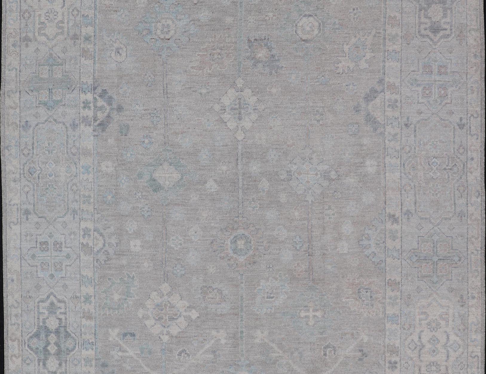 Modern Oushak with Floral Motifs with Cream, Grey, Blue, and Powder Blue. Keivan Woven Arts; rug AWR - 16034 Country of Origin: Afghanistan Type: Oushak Design: Floral, All - Over Abstract - Tribal 21st century. Measures: 6'2 x 10'0 This modern Ousha... - Keivan Woven ArtsAWR - 16034 - 24241Rug