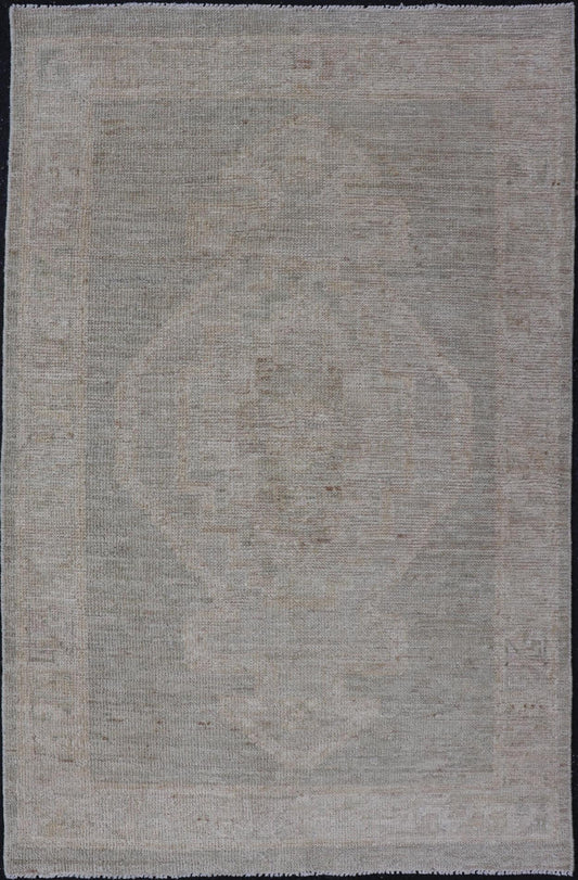 Modern Oushak with Off Gray Background with A Large Tribal Medallion in Cream. Country of Origin: Afghanistan; Type: Oushak; Design: Medallion, Tribal Medallion, All - Over; Keivan Woven Arts: rug AWR - 16772. 21st Century. Measures: 2'8 x 4'3 This... - Keivan Woven ArtsAWR - 16772 - 24444Rug
