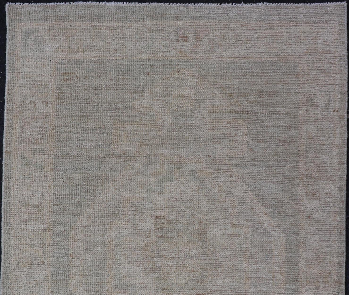 Modern Oushak with Off Gray Background with A Large Tribal Medallion in Cream. Country of Origin: Afghanistan; Type: Oushak; Design: Medallion, Tribal Medallion, All - Over; Keivan Woven Arts: rug AWR - 16772. 21st Century. Measures: 2'8 x 4'3 This... - Keivan Woven ArtsAWR - 16772 - 24444Rug