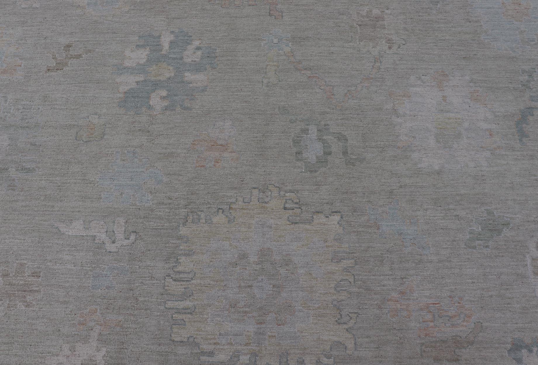 Measures: 12'0 x 15'0 Modern Oushak with Floral Motifs & Muted Colorful Tones on Neutral Background. Keivan Woven Arts; rug AWR - 8347 Country of Origin: Afghanistan Type: Oushak Design. This large Oushak has a border and background that are c... - Keivan Woven ArtsAWR - 16852 - 24970Rug