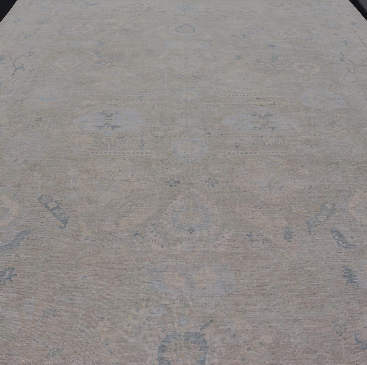 Large Modern Oushak Design in Light Blue, Green, with Light Cream Background. Keivan Woven Arts; rug AWR - 12521 Country of Origin: Afghanistan Type: Oushak Design: All - Over, Floral. Measures: 11'9 x 17'10 This rustic piece holds charm within a po... - Keivan Woven ArtsAWR - 16859 - 24976Rug