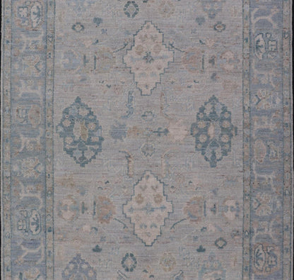 Hand - Knotted Oushak with a Light Blue - Gray Background and Tribal Motifs. Keivan Woven Arts; rug AWR - 16951 Country of Origin: Afghanistan Type: Oushak Design: Floral, All - Over Abstract - Tribal. Measures: 3'10 x 6'0 This Oushak presents centered m... - Keivan Woven ArtsAWR - 16951 - 24786Rug