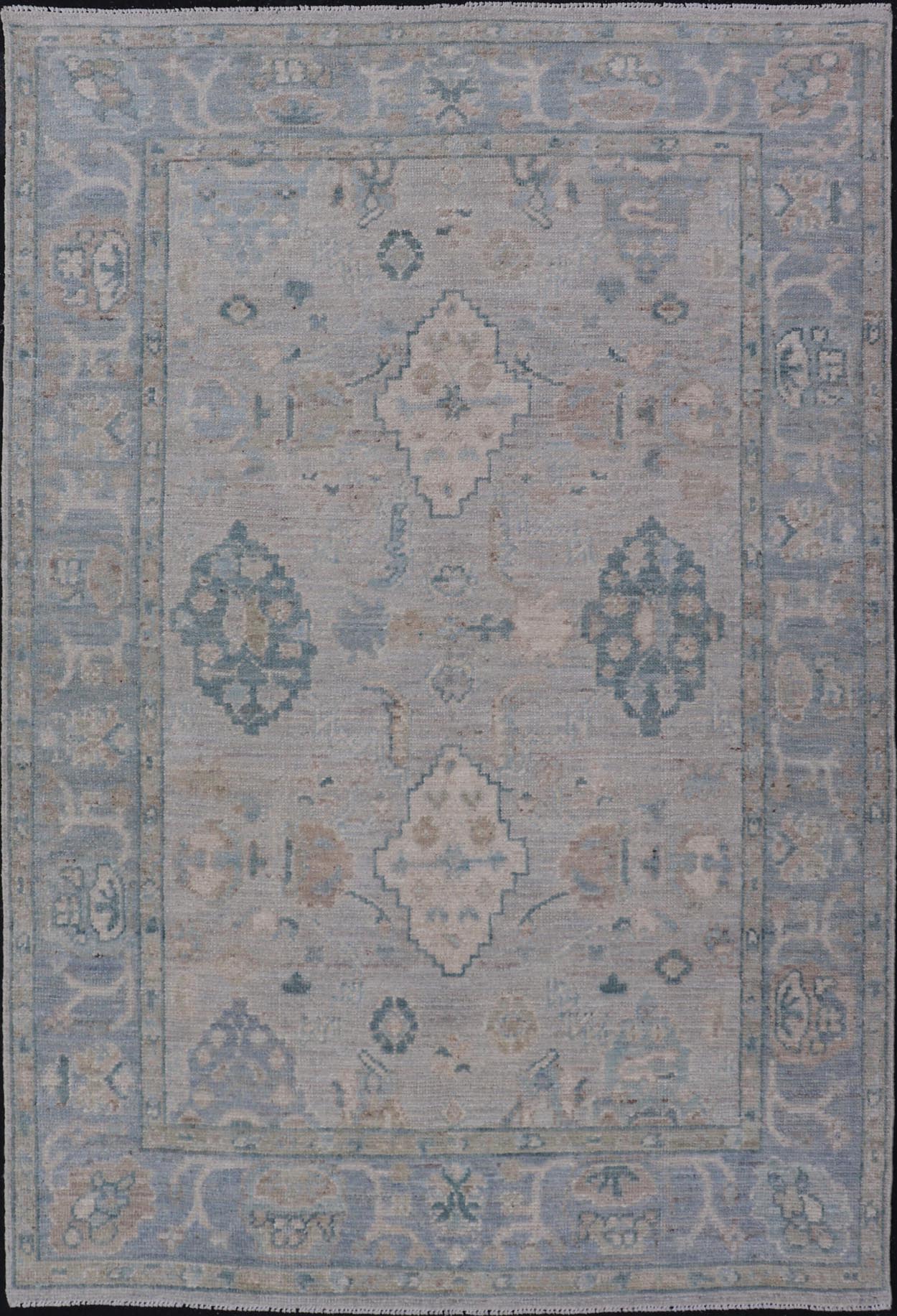 Hand - Knotted Oushak with a Light Blue - Gray Background and Tribal Motifs. Keivan Woven Arts; rug AWR - 16951 Country of Origin: Afghanistan Type: Oushak Design: Floral, All - Over Abstract - Tribal. Measures: 3'10 x 6'0 This Oushak presents centered m... - Keivan Woven ArtsAWR - 16951 - 24786Rug