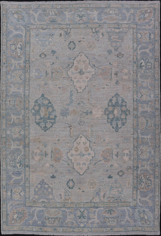 Hand - Knotted Oushak with a Light Blue - Gray Background and Tribal Motifs. Keivan Woven Arts; rug AWR - 16951 Country of Origin: Afghanistan Type: Oushak Design: Floral, All - Over Abstract - Tribal. Measures: 3'10 x 6'0 This Oushak presents centered m... - Keivan Woven ArtsAWR - 16951 - 24786Rug