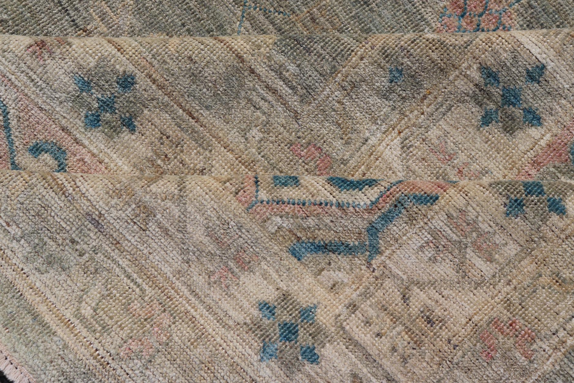 Large Modern Tribal Khotan Rug in Shades of Cream, Green, Blue, and Coral. Keivan Woven Arts Country of origin; Afghanistan Type: Khotan Keivan Woven Arts; rug AWR - 17257, early 21st century. Measures: 10'5 x 13'8 This modern Khotan features a m... - Keivan Woven ArtsAWR - 17257 - 24994Rug