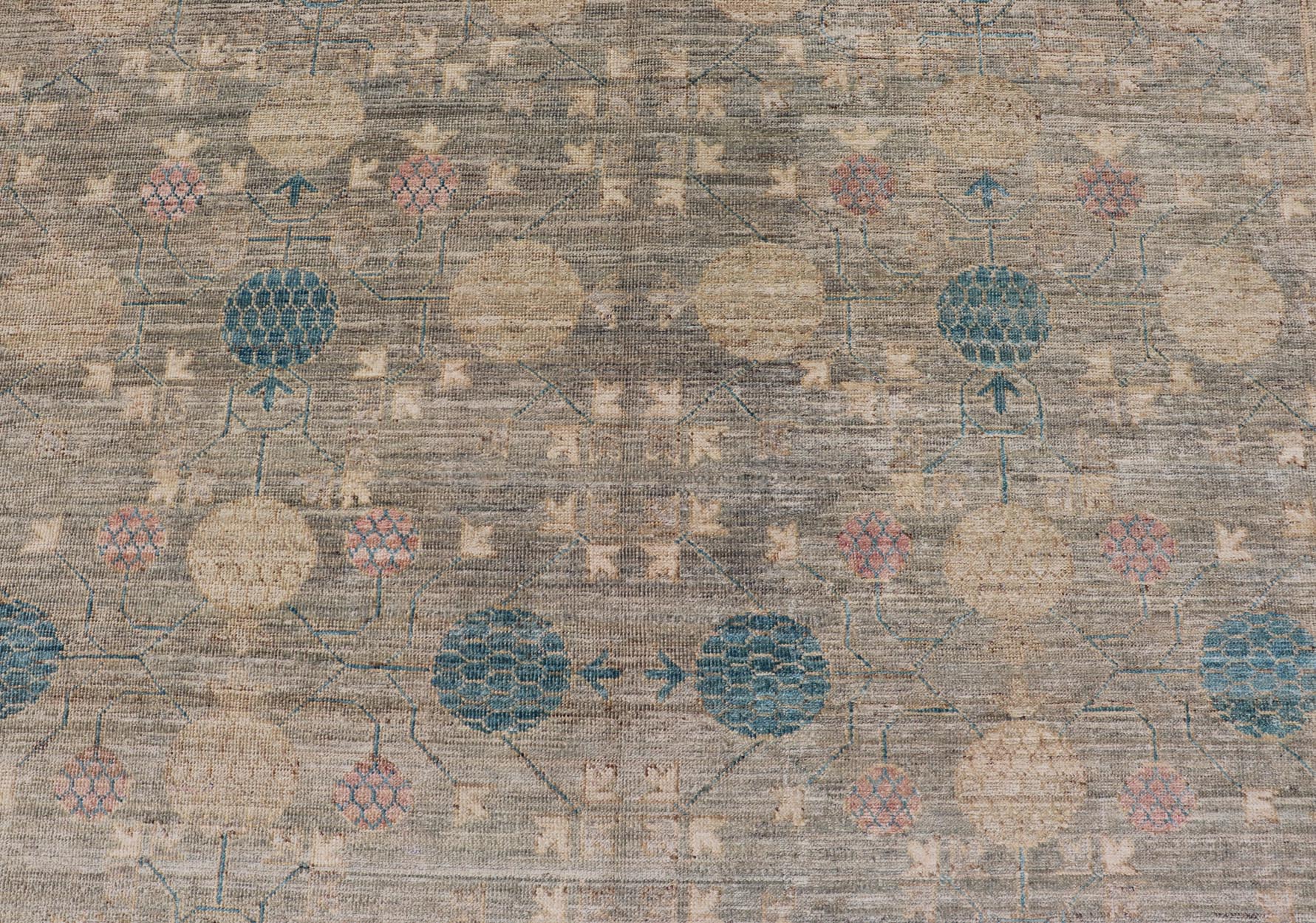 Large Modern Tribal Khotan Rug in Shades of Cream, Green, Blue, and Coral. Keivan Woven Arts Country of origin; Afghanistan Type: Khotan Keivan Woven Arts; rug AWR - 17257, early 21st century. Measures: 10'5 x 13'8 This modern Khotan features a m... - Keivan Woven ArtsAWR - 17257 - 24994Rug