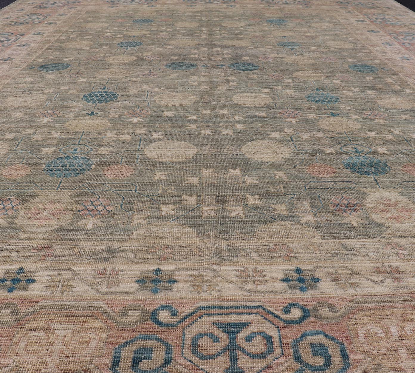 Large Modern Tribal Khotan Rug in Shades of Cream, Green, Blue, and Coral. Keivan Woven Arts Country of origin; Afghanistan Type: Khotan Keivan Woven Arts; rug AWR - 17257, early 21st century. Measures: 10'5 x 13'8 This modern Khotan features a m... - Keivan Woven ArtsAWR - 17257 - 24994Rug