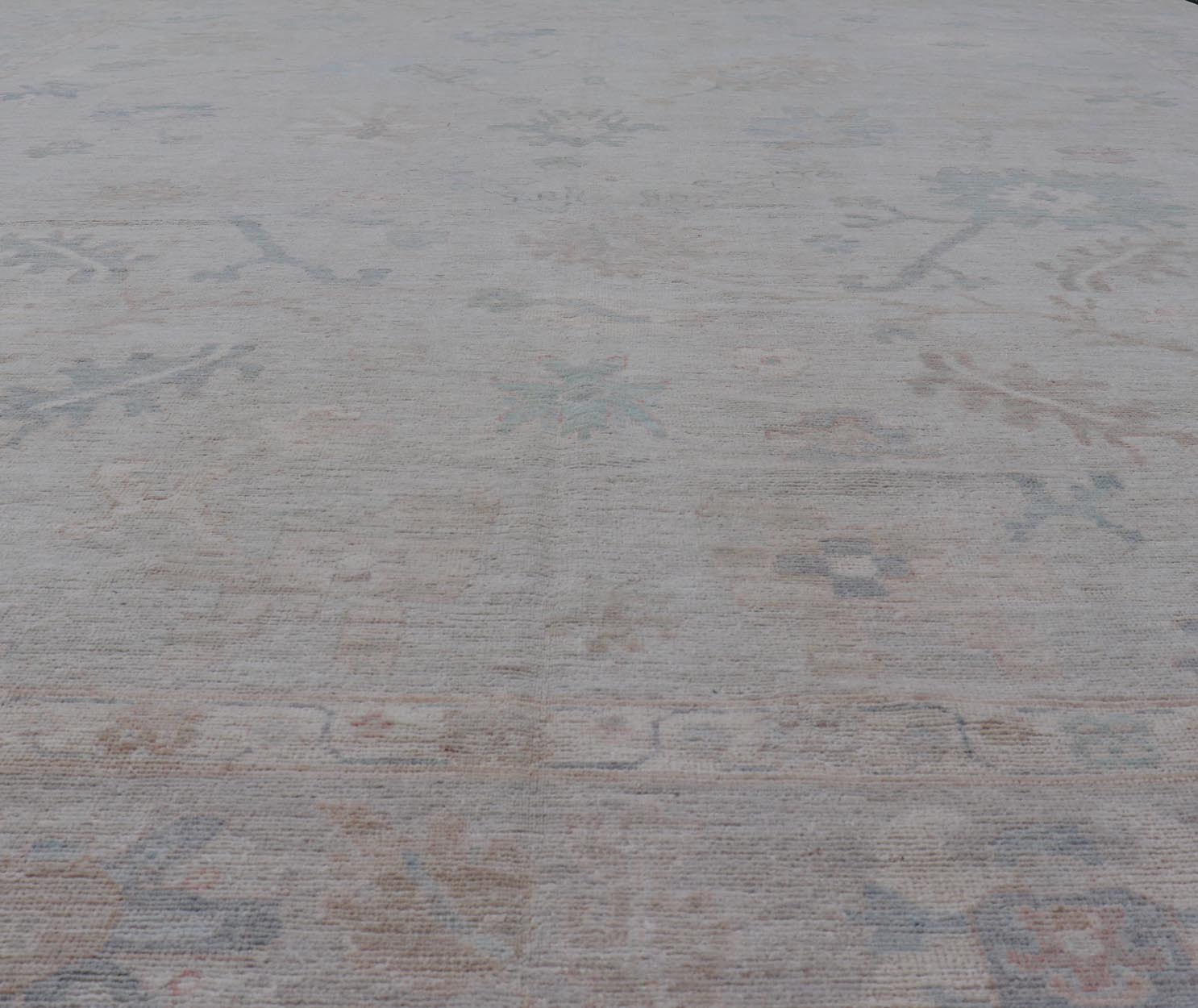 Very Large Modern Oushak with Soft Floral Motifs on Light Gray - Blue Background. Keivan Woven Arts; rug AWR - 17322 / Country of Origin: Afghanistan Type: Oushak Design: Floral. Measures: 12'1 x 17'8 This grandiose Oushak features a wide border, s... - Keivan Woven ArtsAWR - 17322 - 25006Rug
