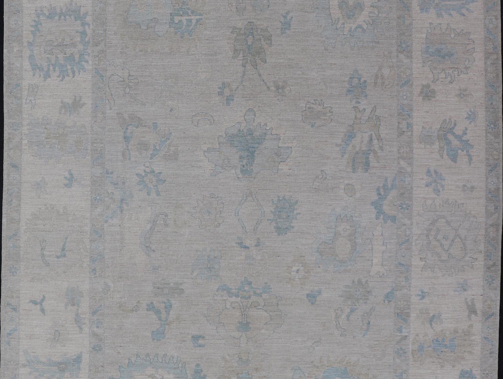 Modern Tribal Oushak with Light Silver - Gray Colored Background and Cream Border. Country of Origin: Afghanistan; Type: Oushak; Design: Medallion, Tribal Medallion, All - Over; Keivan Woven Arts: rug AWR - 17380; Authentic Oushak. Measures: 9'0 x 12'0 ... - Keivan Woven ArtsAWR - 17380 - 25012Rug