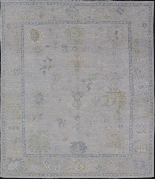Modern Tribal Oushak with a Cream Border and Light Gray - Blue Background. Country of Origin: Afghanistan; Type: Oushak; Design: Medallion, Tribal Medallion, All - Over; Keivan Woven Arts: rug AWR - 17501. Measures: 8'0 x 10'0 A Oushak featuring all... - Keivan Woven ArtsAWR - 17501 - 24910Rug