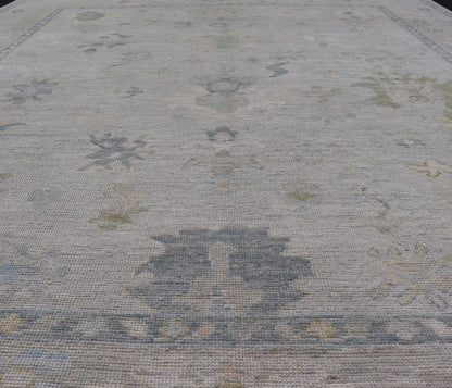 Modern Tribal Oushak with a Cream Border and Light Gray - Blue Background. Country of Origin: Afghanistan; Type: Oushak; Design: Medallion, Tribal Medallion, All - Over; Keivan Woven Arts: rug AWR - 17501. Measures: 8'0 x 10'0 A Oushak featuring all... - Keivan Woven ArtsAWR - 17501 - 24910Rug
