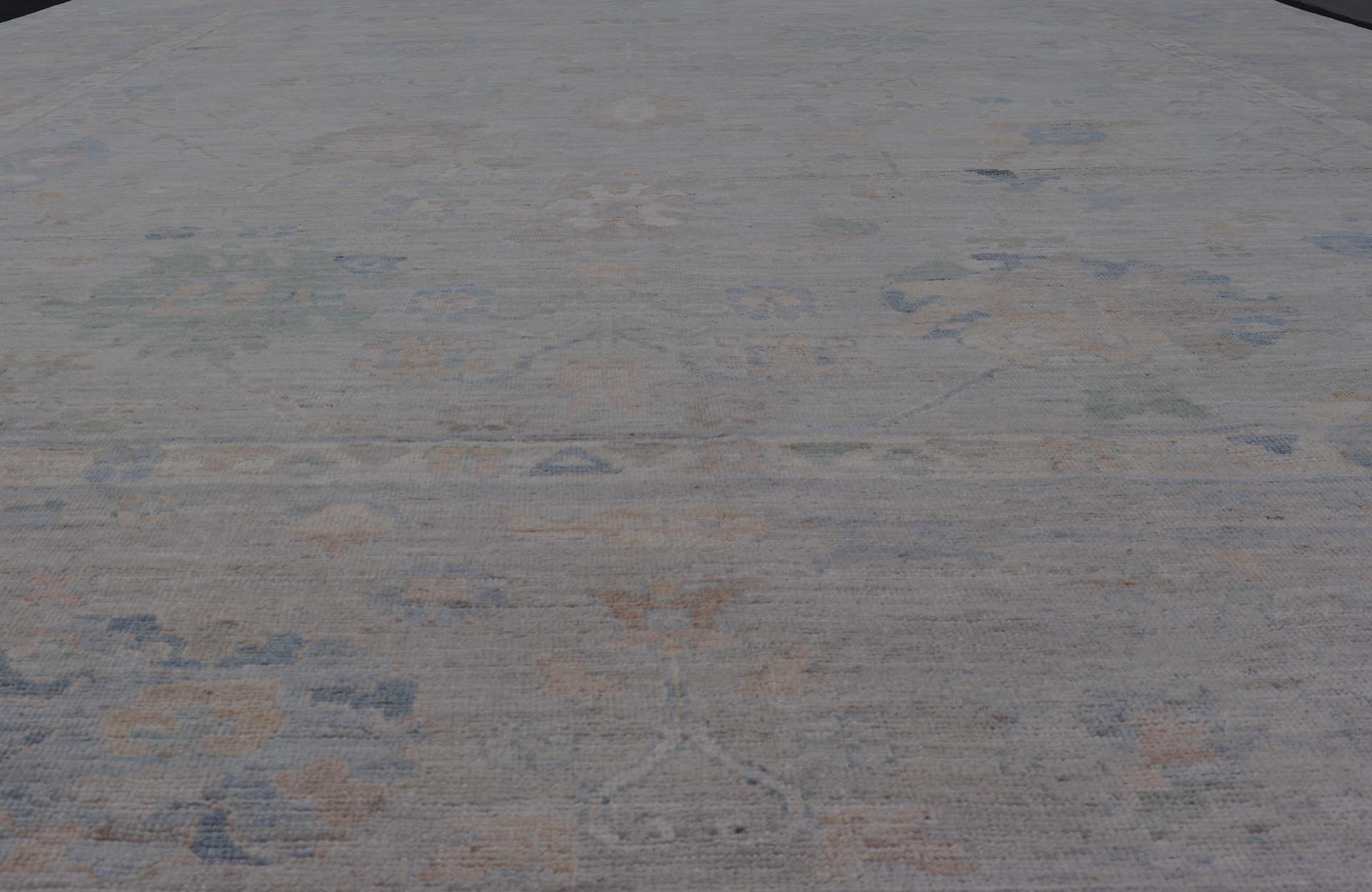 Modern All - Over Floral Oushak with Light Gray - Blue Background And Neutral Color. Keivan Woven Arts rug AWR - 17559 Country of Origin: Afghanistan Type: Oushak Design: Floral, All - Over, Abstract Floral. Measures: 12'1 x 14'8 This Oushak was hand - kn... - Keivan Woven ArtsAWR - 17559 - 25024Rug