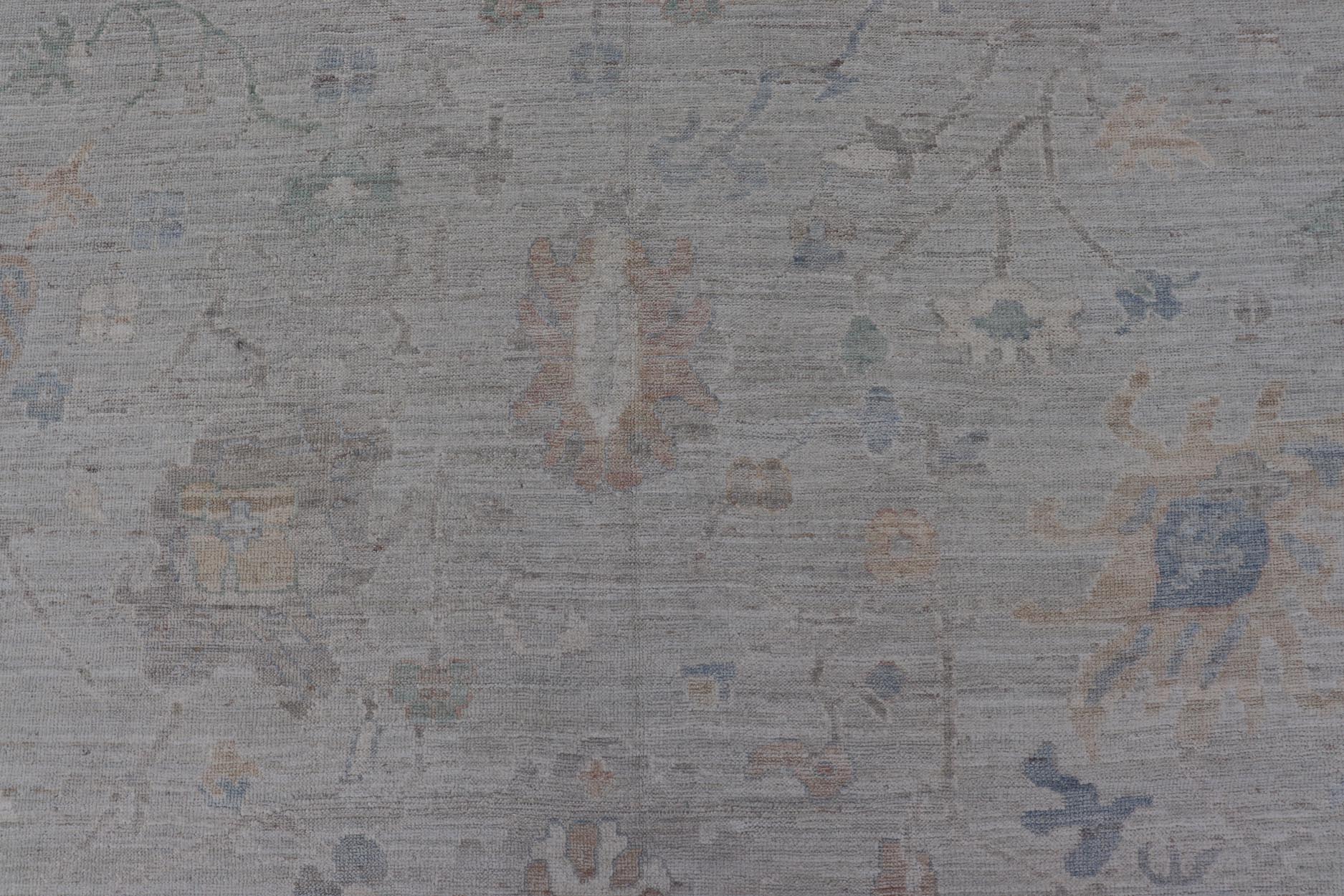 Modern All - Over Floral Oushak with Light Gray - Blue Background And Neutral Color. Keivan Woven Arts rug AWR - 17559 Country of Origin: Afghanistan Type: Oushak Design: Floral, All - Over, Abstract Floral. Measures: 12'1 x 14'8 This Oushak was hand - kn... - Keivan Woven ArtsAWR - 17559 - 25024Rug