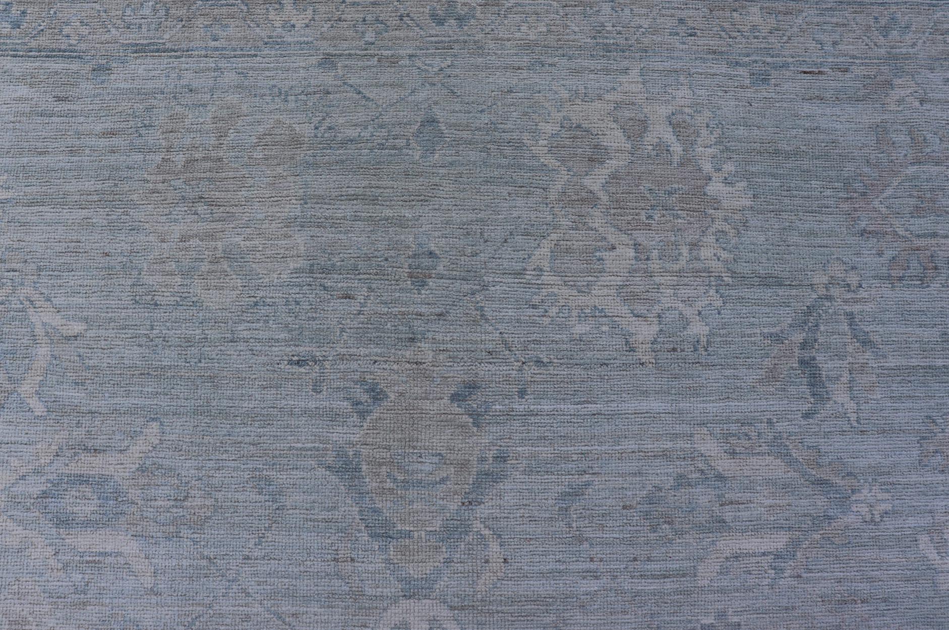 Oushak Modern with Floral Motifs with Cream, Grey, Blue, and Powder Blue. Keivan Woven Arts; rug AWR - 17574 Country of Origin: Afghanistan Type: Oushak Design: Floral, All - Over Abstract - Tribal 21st century. Measures: 8'10 x 11'9 This modern Oush... - Keivan Woven ArtsAWR - 17574 - 25030Rug