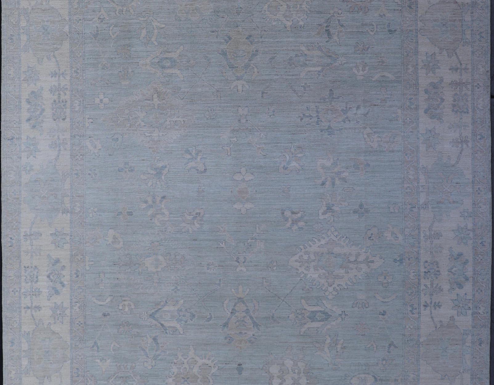 Oushak Modern with Floral Motifs with Cream, Grey, Blue, and Powder Blue. Keivan Woven Arts; rug AWR - 17574 Country of Origin: Afghanistan Type: Oushak Design: Floral, All - Over Abstract - Tribal 21st century. Measures: 8'10 x 11'9 This modern Oush... - Keivan Woven ArtsAWR - 17574 - 25030Rug