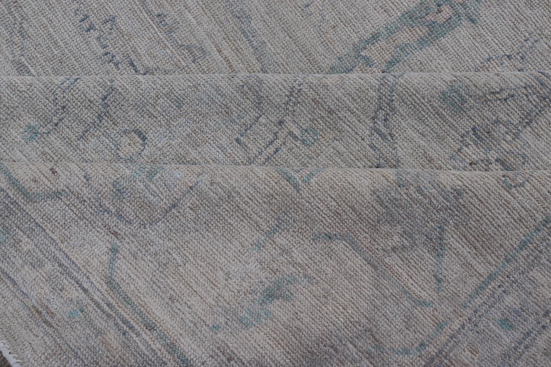 Very Large Modern Afghan Oushak with Soft Floral Motifs on Light Blue Background. Keivan Woven Arts; rug AWR - 17608 Country of Origin: Afghanistan Type: Oushak Design: Floral. Measures: 13'2 x 19'9 This grandiose Oushak features a wide border, sh... - Keivan Woven ArtsAWR - 17608 - 25048Rug