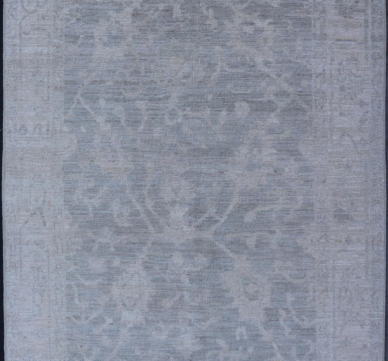 Modern Tribal Oushak with a Cream Border and Light Gray - Green Background. Keivan Woven Arts: rug / AWR - 17770 / Country of Origin: Afghanistan; Type: Oushak; Design: Medallion, Tribal Medallion, All - Over. Measures: 3'10 x 6'0 A Oushak featuring... - Keivan Woven ArtsAWR - 17770 - 25054Rug