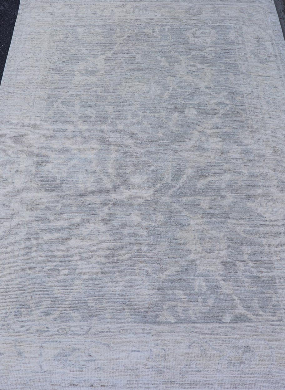 Modern Tribal Oushak with a Cream Border and Light Gray - Green Background. Keivan Woven Arts: rug / AWR - 17770 / Country of Origin: Afghanistan; Type: Oushak; Design: Medallion, Tribal Medallion, All - Over. Measures: 3'10 x 6'0 A Oushak featuring... - Keivan Woven ArtsAWR - 17770 - 25054Rug