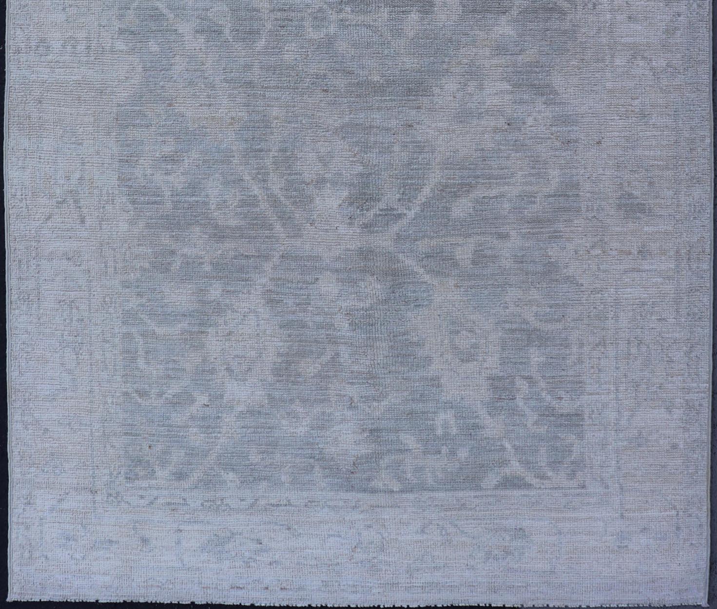 Modern Tribal Oushak with a Cream Border and Light Gray - Green Background. Keivan Woven Arts: rug / AWR - 17770 / Country of Origin: Afghanistan; Type: Oushak; Design: Medallion, Tribal Medallion, All - Over. Measures: 3'10 x 6'0 A Oushak featuring... - Keivan Woven ArtsAWR - 17770 - 25054Rug