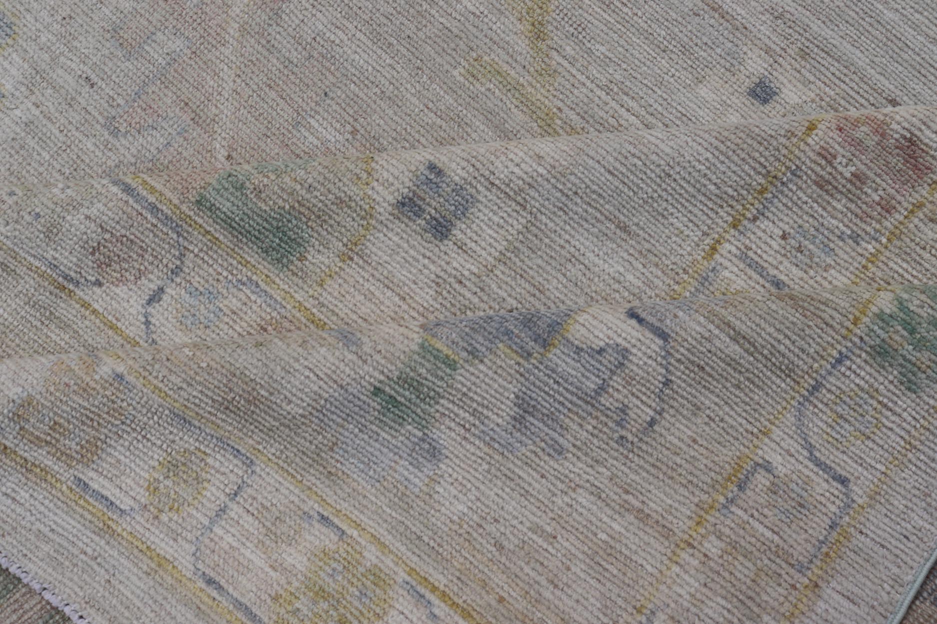 Large Oushak Rug with Floral Motifs & Muted Colorful Tones on Neutral Background. Large Oushak Rug with Floral Motifs & Muted Colorful Tones by Keivan Woven Arts. Keivan Woven Arts; rug AWR - 17857 Country of Origin: Afghanistan Type: Oushak Desi... - Keivan Woven ArtsAWR - 17857 - 25066Rug