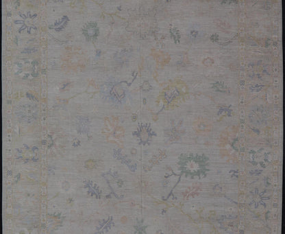Large Oushak Rug with Floral Motifs & Muted Colorful Tones on Neutral Background. Large Oushak Rug with Floral Motifs & Muted Colorful Tones by Keivan Woven Arts. Keivan Woven Arts; rug AWR - 17857 Country of Origin: Afghanistan Type: Oushak Desi... - Keivan Woven ArtsAWR - 17857 - 25066Rug