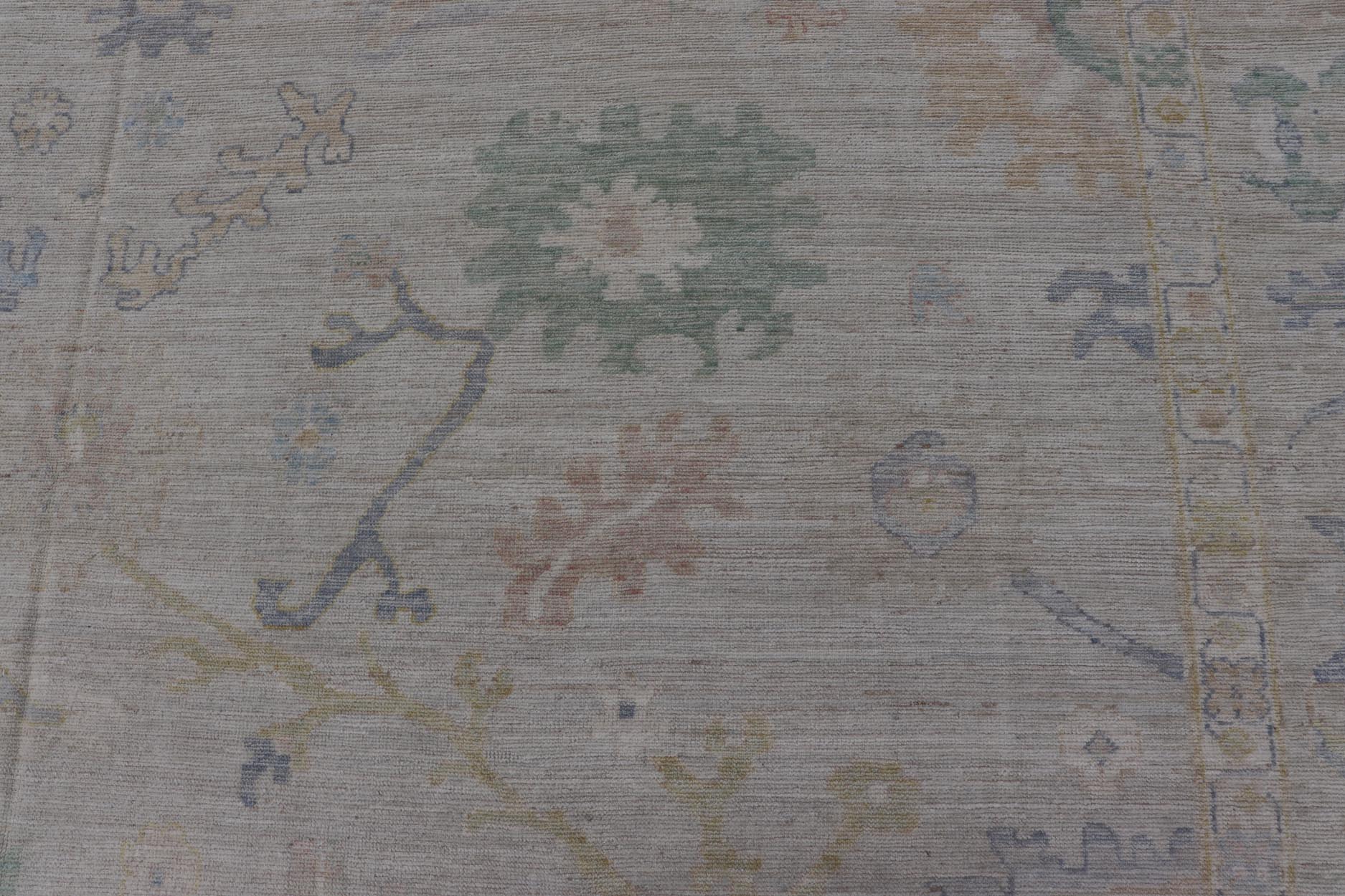 Large Oushak Rug with Floral Motifs & Muted Colorful Tones on Neutral Background. Large Oushak Rug with Floral Motifs & Muted Colorful Tones by Keivan Woven Arts. Keivan Woven Arts; rug AWR - 17857 Country of Origin: Afghanistan Type: Oushak Desi... - Keivan Woven ArtsAWR - 17857 - 25066Rug