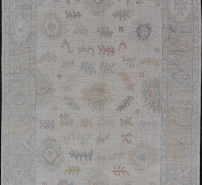 Large Oushak Rug with Floral Motifs & Muted Colorful Tones on Neutral Background. Keivan Woven Arts; rug AWR - 17881 Country of Origin: Afghanistan Type: Oushak Design. Measures: 5'10 x 9'1 This large Oushak has a border and background that are co... - Keivan Woven ArtsAWR - 17881 - 24916Rug