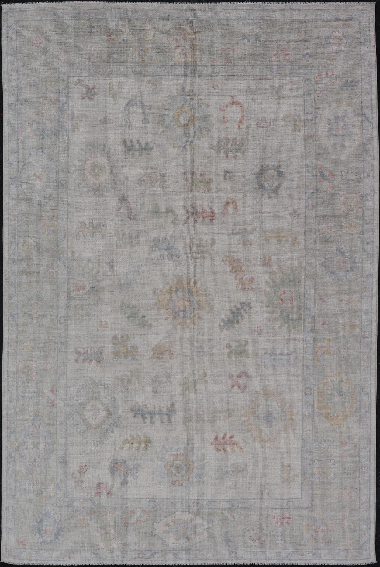Large Oushak Rug with Floral Motifs & Muted Colorful Tones on Neutral Background. Keivan Woven Arts; rug AWR - 17881 Country of Origin: Afghanistan Type: Oushak Design. Measures: 5'10 x 9'1 This large Oushak has a border and background that are co... - Keivan Woven ArtsAWR - 17881 - 24916Rug