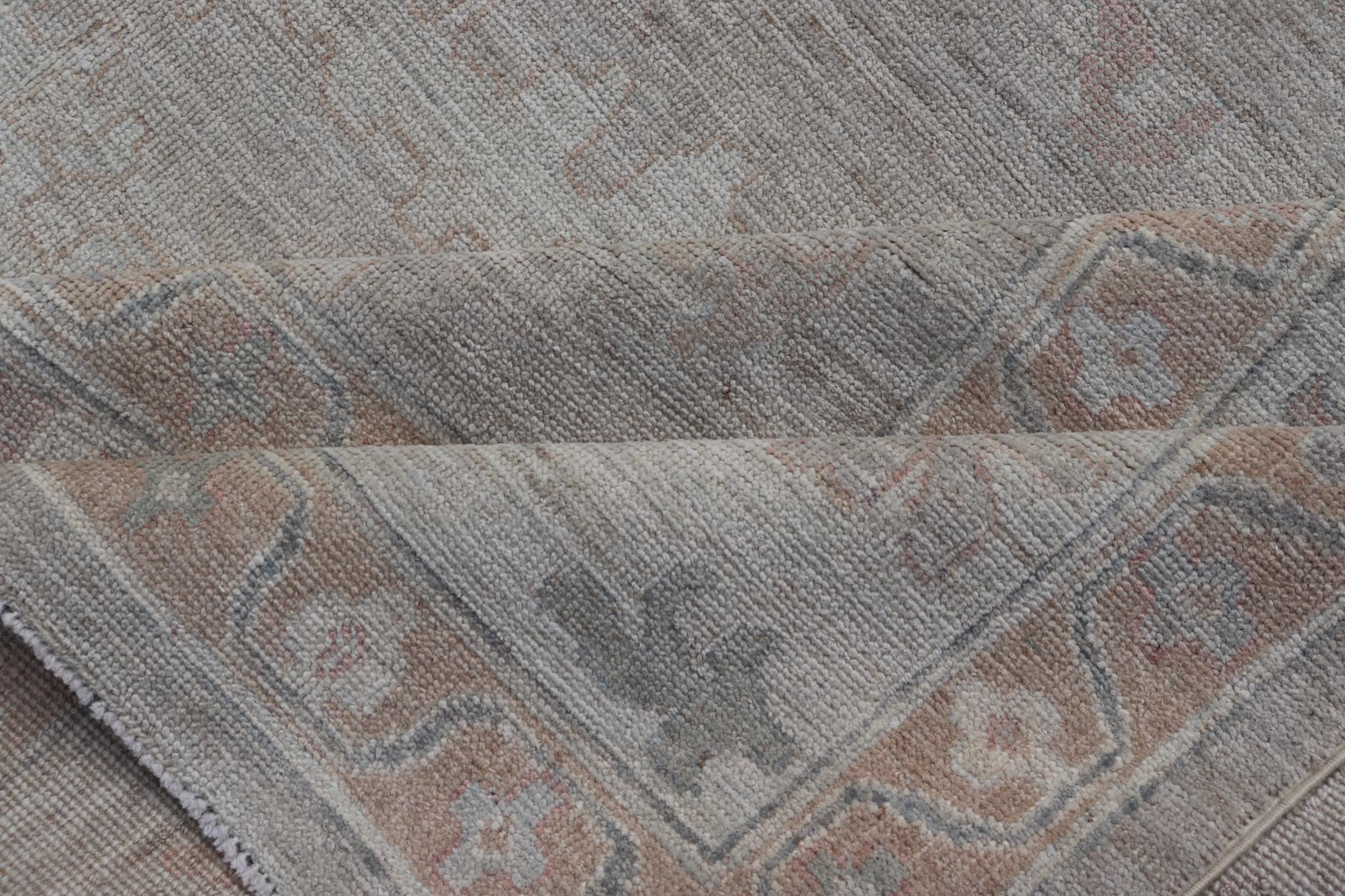 All - Over Floral Modern Oushak with Light Tan Background and Cream Border. Keivan Woven Arts rug AWR - 17919 Country of Origin: Afghanistan Type: Oushak Design: Floral, all - over, abstract floral. Measures: 10'1 x 13'10 This Oushak was hand knotted ... - Keivan Woven ArtsAWR - 17919 - 25078Rug