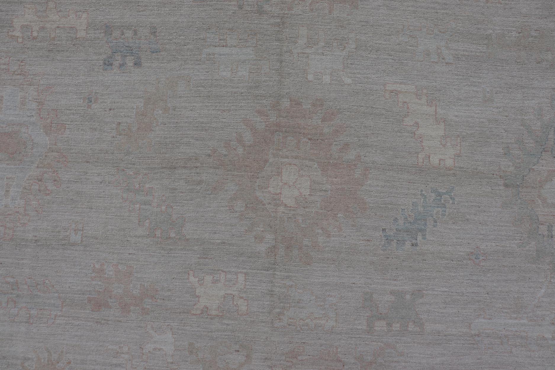 All - Over Floral Modern Oushak with Light Tan Background and Cream Border. Keivan Woven Arts rug AWR - 17919 Country of Origin: Afghanistan Type: Oushak Design: Floral, all - over, abstract floral. Measures: 10'1 x 13'10 This Oushak was hand knotted ... - Keivan Woven ArtsAWR - 17919 - 25078Rug