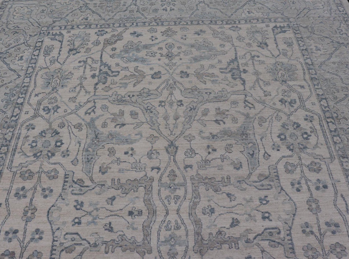 Measures: 10'6 x 14'0 Keivan Woven Arts Modern Oushak on Light Cream Background and Blue Design. Keivan Woven Arts; rug AWR - 355 Country of Origin: Afghanistan Type: Oushak Design. The border and field are covered in floral - like motifs filled wit... - Keivan Woven ArtsAWR - 355 - 27442Rug